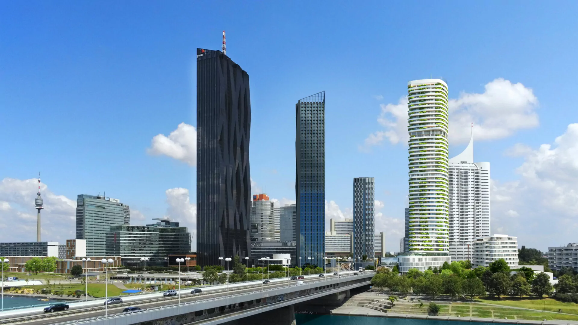 The DANUBEFLATS residential tower in Vienna – in a panoramic view with other buildings.