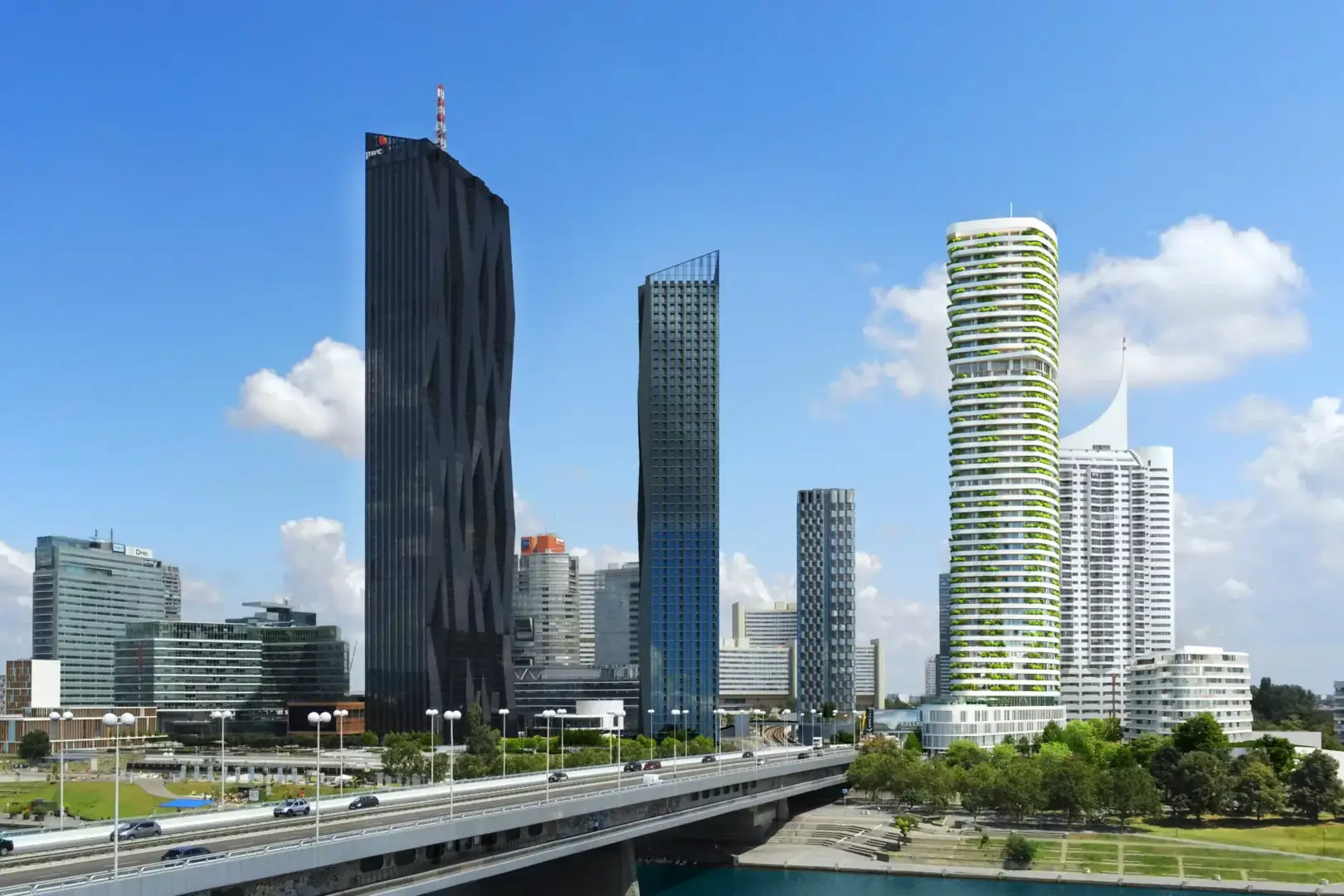 The DANUBEFLATS residential tower in Vienna – in a panoramic view with other buildings.